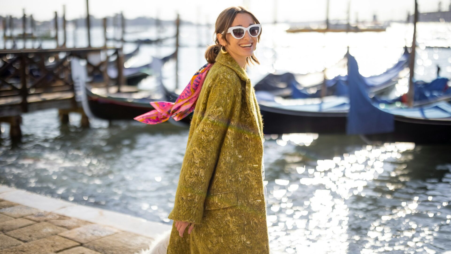 Stylish woman walking in Venice, Italy