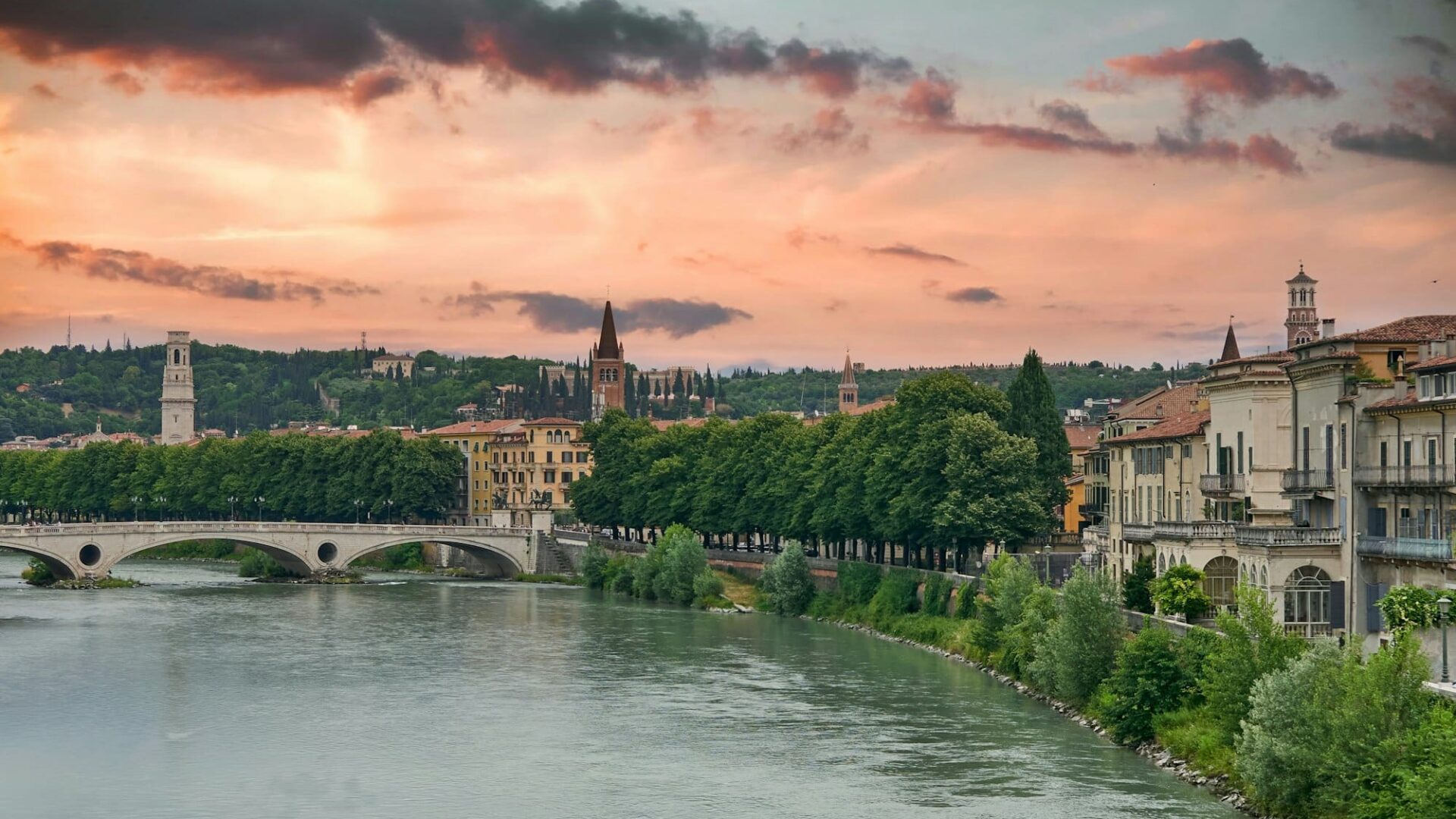 Amazing cityscape with dramatic sky over river in Verona.