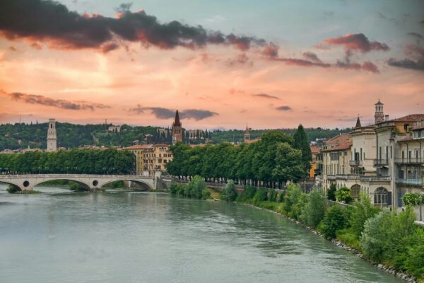 Amazing cityscape with dramatic sky over river in Verona.