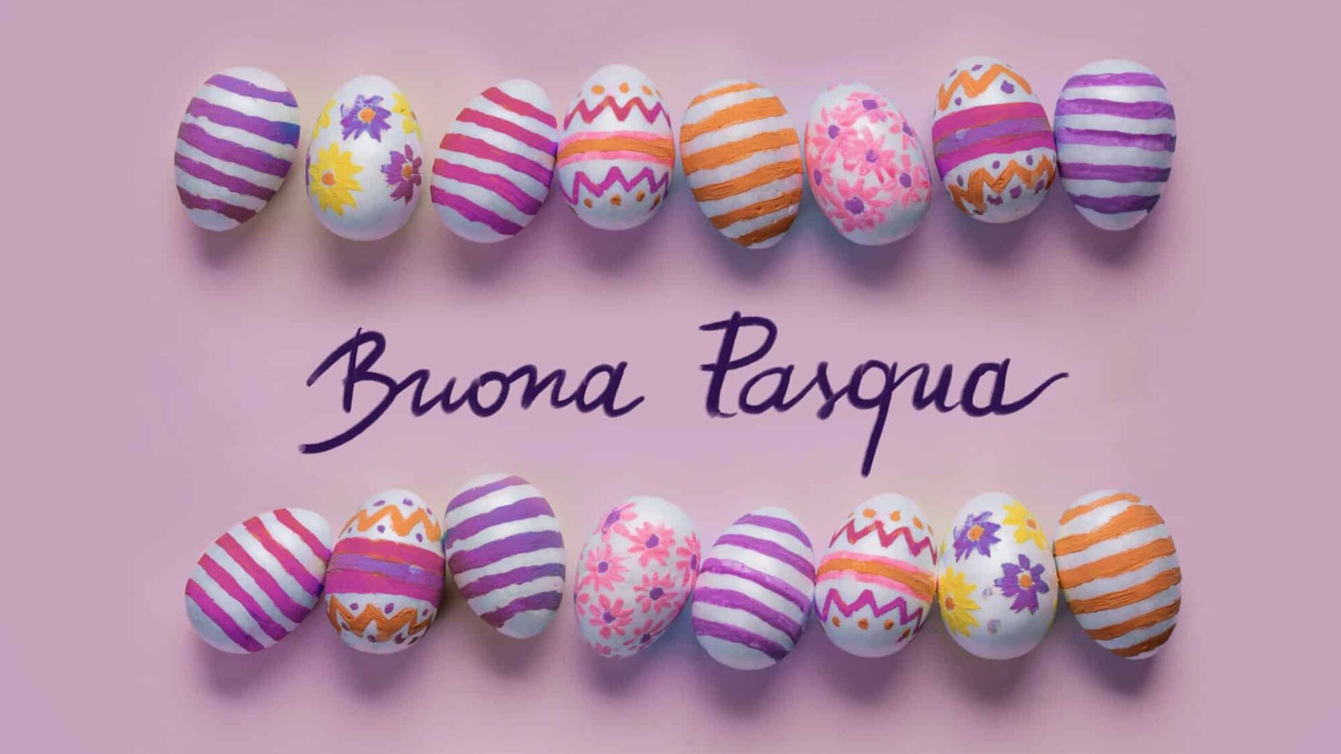Decorated Easter Eggs with "Buona Pasqua" message on pink background