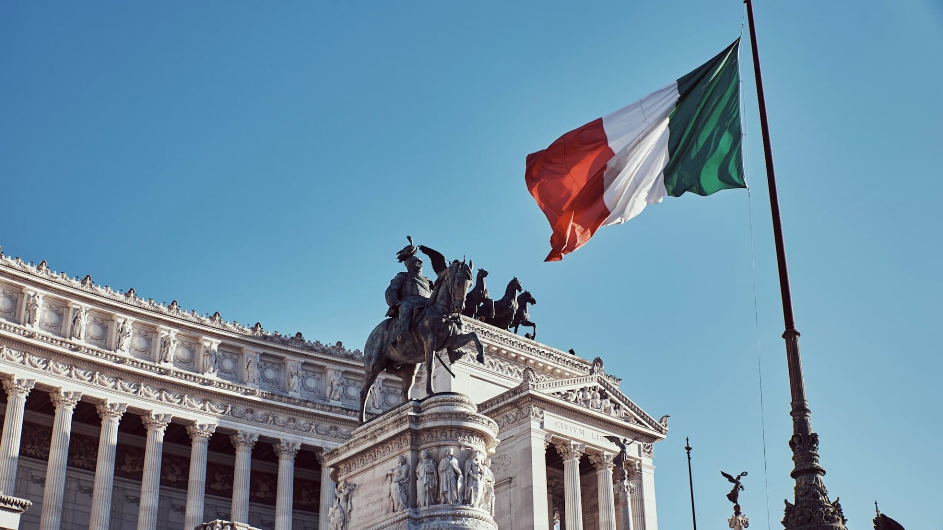 Monument to the homeland with the official flag of the Italian country