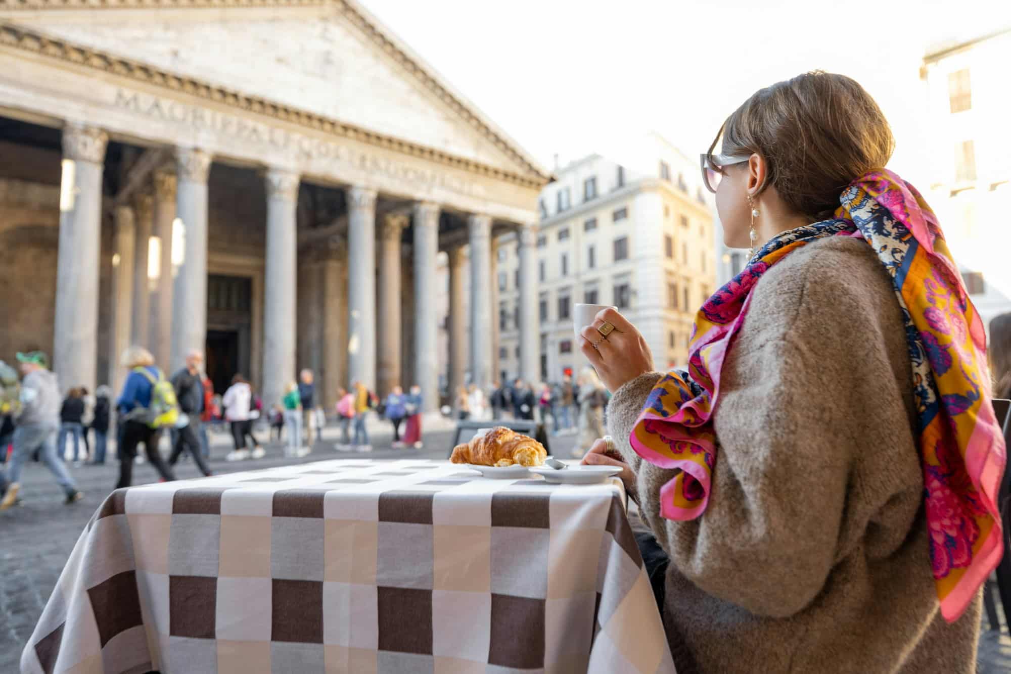 Woman sitting at outdoor cafe in Rome