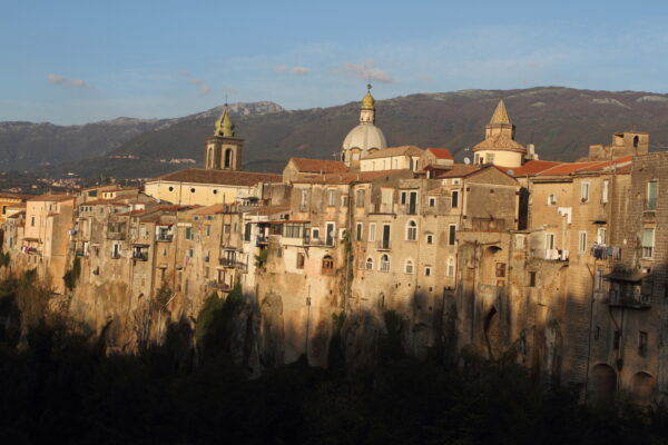 Ancient Italian village on a cliff at dawn.