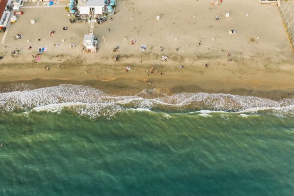 Beach with sea and bathers seen from above