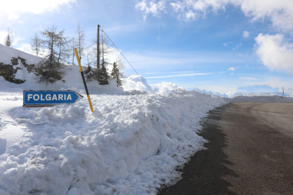 road sign for folgaria in northern italy in winter with snow