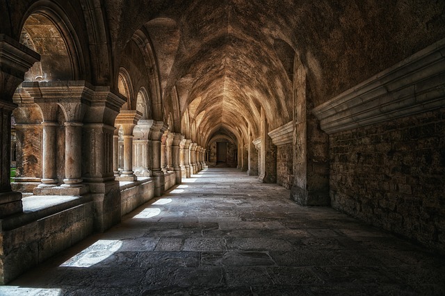 Corridor with stone arches and columns